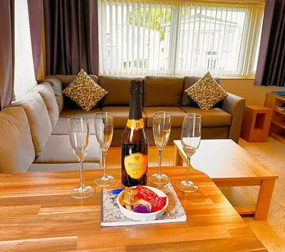 a bottle of wine and three wine glasses on a table at 13 Chorley close in Walton-on-the-Naze