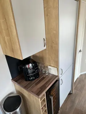 a small kitchen with a counter and a microwave at 13 Chorley close in Walton-on-the-Naze