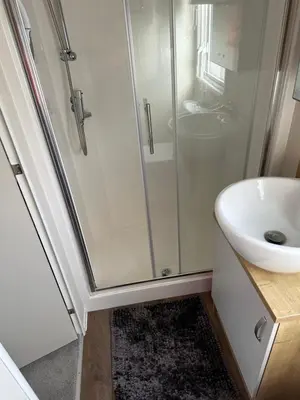 a bathroom with a shower and a sink at 13 Chorley close in Walton-on-the-Naze