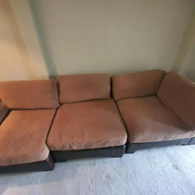 a brown couch sitting in a living room at Beautiful and Cozy 2 Bedroom Apartment Billericay in Billericay