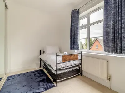 a bedroom with a bed and a window at The Great Escape in Ipswich