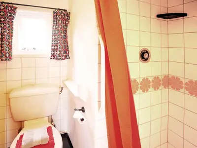 a bathroom with a toilet and a shower at Prospect Place by The Suffolk Cottage Collection in Westleton