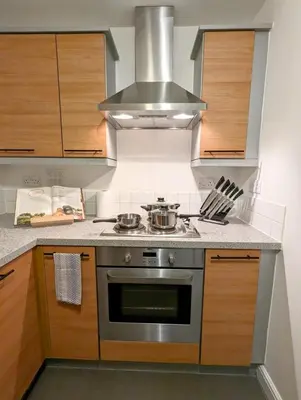 a kitchen with a stainless steel stove top oven at 2-Bed, Sleeps 5, 2 Bath, Parking, WiFi in Colchester