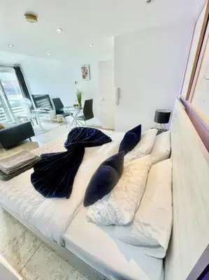 a white bed with pillows on it in a room at Cambridge City Centre Studio First Floor Sleeps 3 in Cambridge