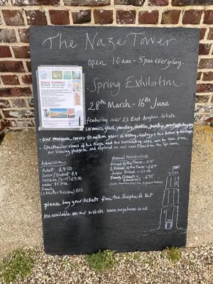 a sign for the nash tavern on a brick wall at High view house, 3 bed flat, Number 41A in Walton-on-the-Naze