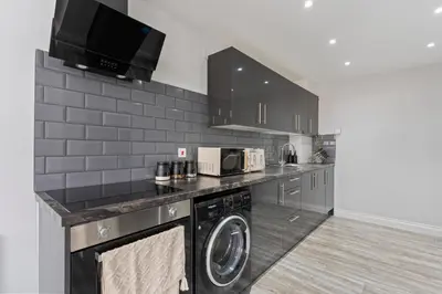a kitchen with a washer and dryer at Harwich Luxury Suite in Harwich