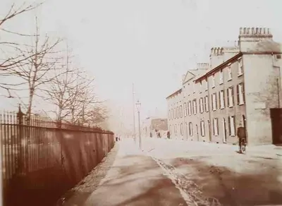 an old photo of a street with a building at Historical Police Station Building l Central Cambridge I Park View in Cambridge