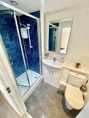 a bathroom with a shower and a toilet and a sink at Studio - Sleeps 3 - Parking - Wifi in Cambridge