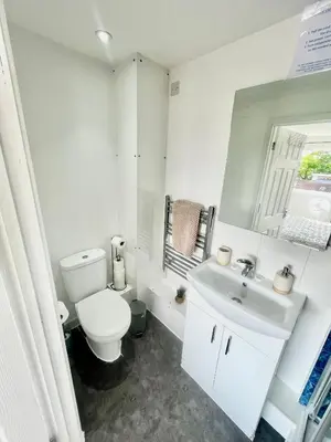 a white bathroom with a toilet and a sink at City Centre Cozy Studio flat Second Floor in Cambridge