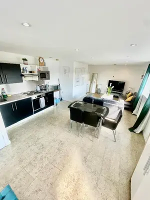 a living room with a couch and a table at City Centre Cozy Studio flat Second Floor in Cambridge