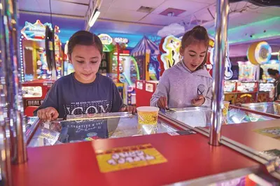 two young children playing at a food counter in a store at Coastal caravan retreat in Brightlingsea
