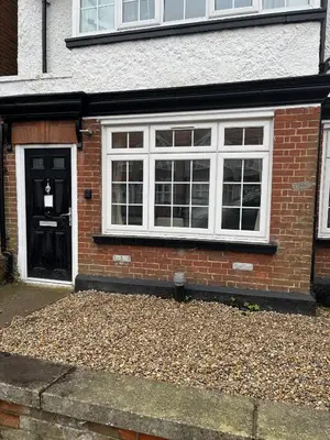 a brick house with white windows and a door at AcLand Lodge Dovercourt West in Harwich