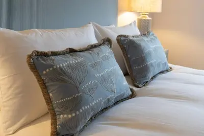two pillows sitting on top of a bed at Charming 4 Bed Cottage in Herts Countryside - Pass the Keys in Sacomb