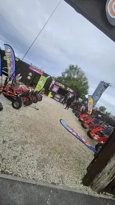 a row of motorcycles parked in a parking lot at Pura Vida Caravan in Saint Osyth