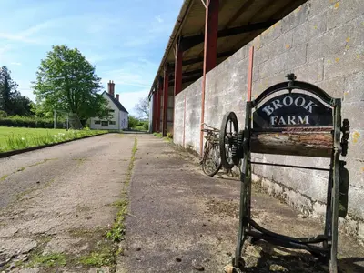 a sign that says spoon farm next to a building at Brook Farm in Harleston