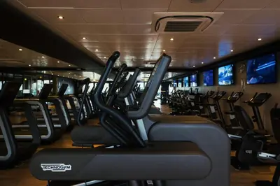 a gym with rows of treadmills at Great Blunts Stables - Stock Brook Manor Golf Club in Billericay