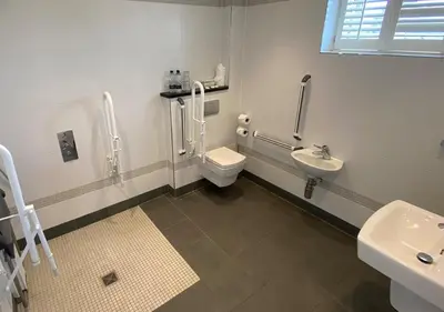 a bathroom with a toilet and a sink at Great Blunts Stables - Stock Brook Manor Golf Club in Billericay