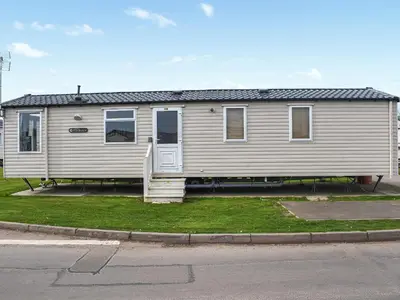a house that is sitting on the side of a street at Swift Johnson in Dovercourt