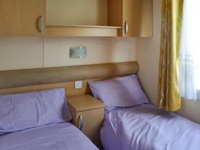 two beds sitting next to each other in a room at Swift Johnson in Dovercourt