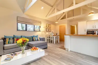 a living room with a couch and a table at 2 Bed in Heveningham oc-w29033 in Heveningham