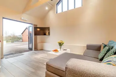 a living room with a couch and a window at 2 Bed in Heveningham oc-w29033 in Heveningham