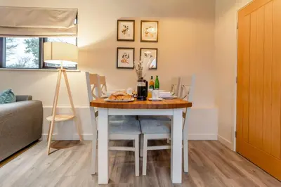 a dining room with a table and chairs and a couch at 2 Bed in Heveningham oc-w29033 in Heveningham