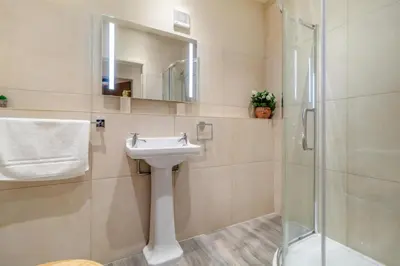 a bathroom with a sink and a shower at 2 Bed in Heveningham oc-w29033 in Heveningham