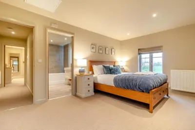 a bedroom with a bed and a large window at 2 Bed in Heveningham oc-w29035 in Heveningham
