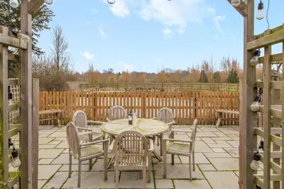 a patio with a table and chairs and a fence at 2 Bed in Heveningham oc-w29035 in Heveningham