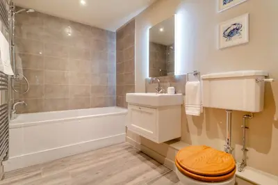 a bathroom with a toilet and a sink and a tub at 2 Bed in Heveningham oc-w29035 in Heveningham