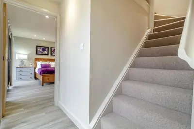 a hallway with stairs leading to a bedroom at 3 Bed in Heveningham oc-w29030 in Heveningham