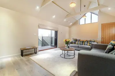 a living room with a couch and a table at 3 Bed in Heveningham oc-w29030 in Heveningham
