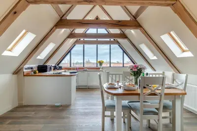 a kitchen and dining room with a table and chairs at 1 Bed in Heveningham oc-w29032 in Heveningham