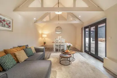 a living room with a couch and a table at 2 Bed in Heveningham oc-w29029 in Heveningham