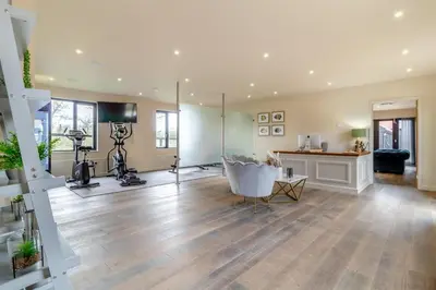 a large living room with wood floors and a room with a camera at 2 Bed in Heveningham oc-w29029 in Heveningham