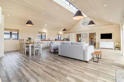 a living room with a couch and a table at 4 Bed in Heveningham oc-w29036 in Heveningham