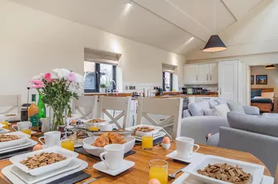 a dining room with a table with food on it at 4 Bed in Heveningham oc-w29036 in Heveningham