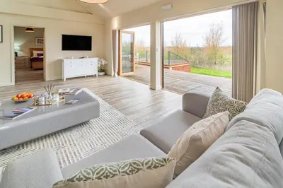 a living room with a couch and a table at 4 Bed in Heveningham oc-w29036 in Heveningham