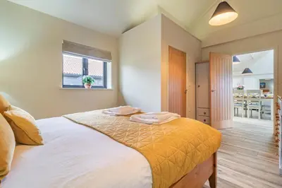 a bedroom with a bed with two towels on it at 4 Bed in Heveningham oc-w29036 in Heveningham
