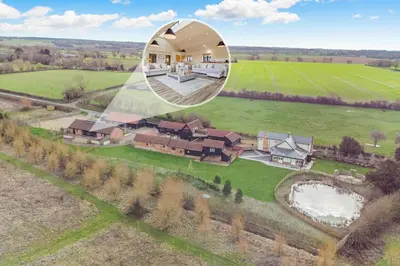 an aerial view of a house with a reflection in a mirror at 4 Bed in Heveningham oc-w29036 in Heveningham
