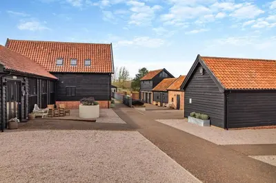 a row of houses with roofs on a street at 4 Bed in Heveningham oc-w29036 in Heveningham