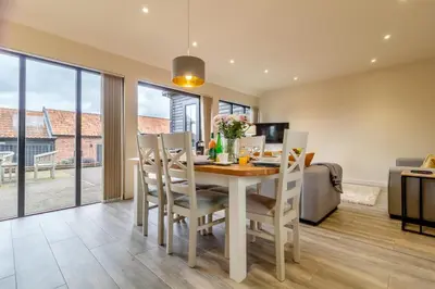 a kitchen and dining room with a table and chairs at 3 Bed in Heveningham oc-w29031 in Heveningham