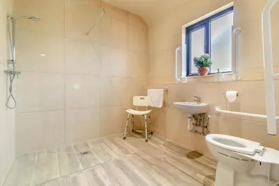 a bathroom with a sink and a toilet and a window at 3 Bed in Heveningham oc-w29031 in Heveningham