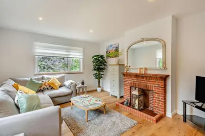 a living room with a couch and a fireplace at 3 Bed in Acton oc-c28929 in Great Waldingfield