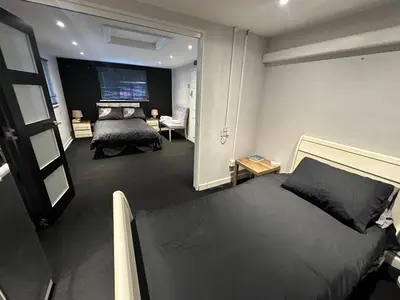a bedroom with a large bed in a room at The Stables in Takeley