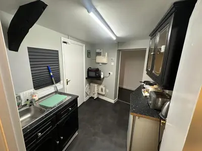 a kitchen with a sink and a counter top at The Stables in Takeley