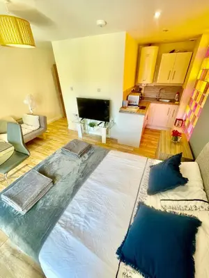 a living room with a large bed on the floor at cambridge city centre immaculate Studio sleeps 2 - central location paradise street in Cambridge