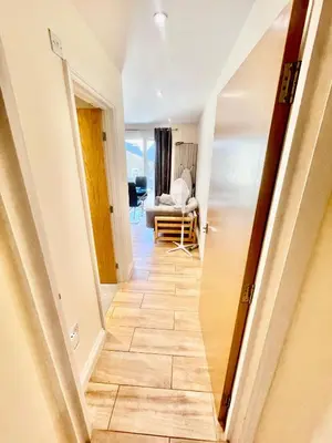 a hallway with a door leading to a living room at cambridge city centre immaculate Studio sleeps 2 - central location paradise street in Cambridge