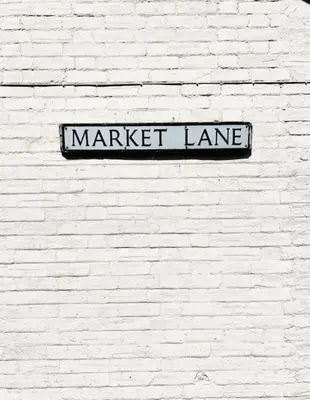 a street sign on a white brick wall at The Hideout in Linton