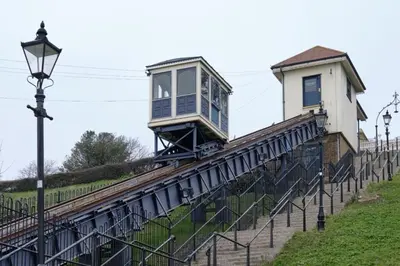 a house sitting on top of a train track at Entire studio with private parking and balcony in Southend-on-Sea
